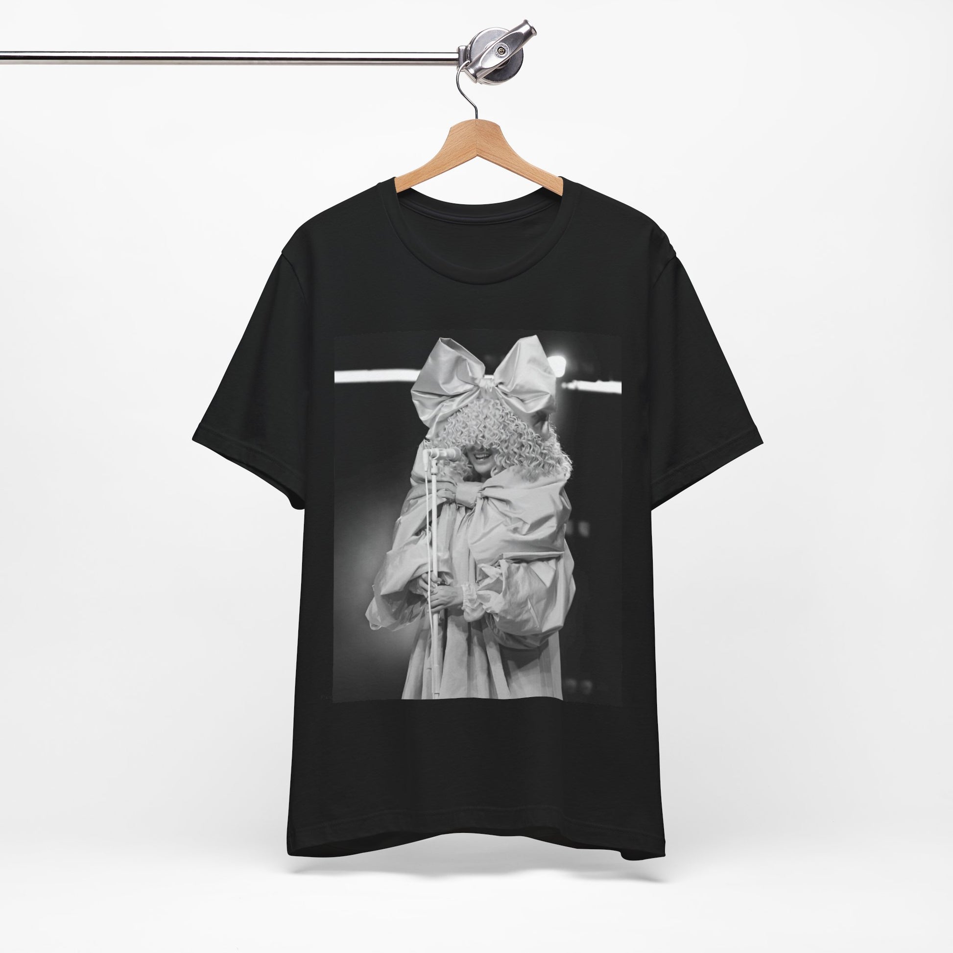 A black graphic t-shirt featuring a black and white, monochrome graphic or photo of Sia.