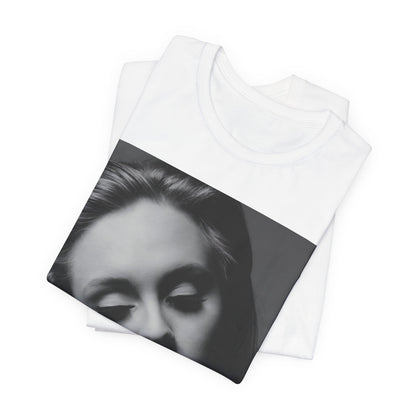 A black graphic t-shirt featuring the album cover art for Adele's '21' album, showing a close-up portrait of her with a contemplative expression.