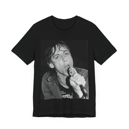 A black graphic t-shirt featuring a 70s graphic or photo of Iggy Pop performing in a wild concert.