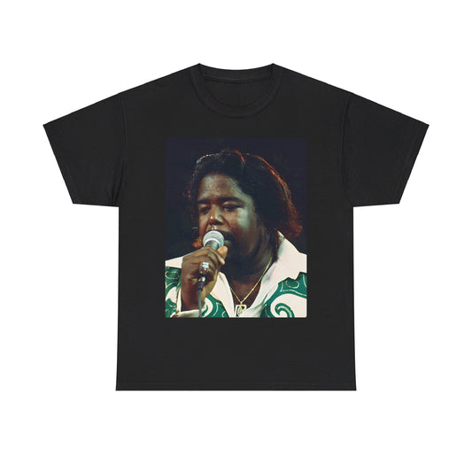 A black graphic t-shirt featuring a graphic or photo of Barry White from the 1970s disco era, possibly performing in concert.