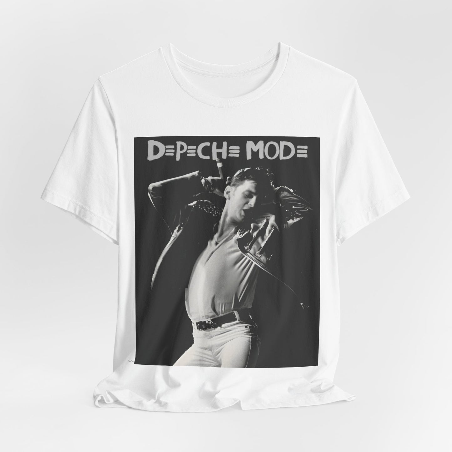 A black graphic t-shirt featuring a black and white graphic or photo of Depeche Mode performing live on stage.