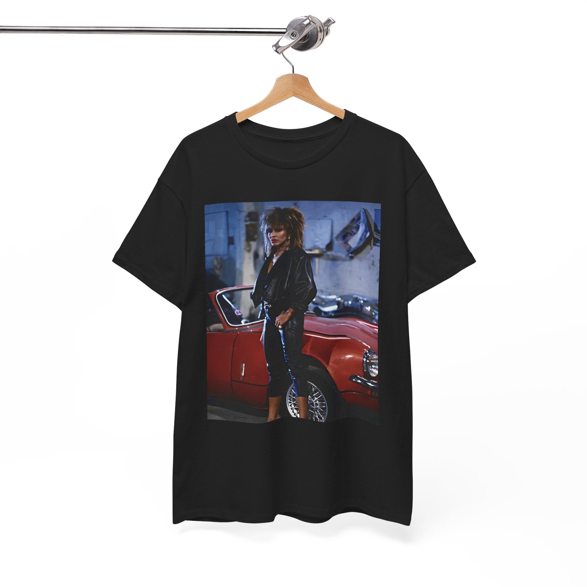 A black graphic t-shirt featuring an 80s graphic of Tina Turner as a powerful rock woman.