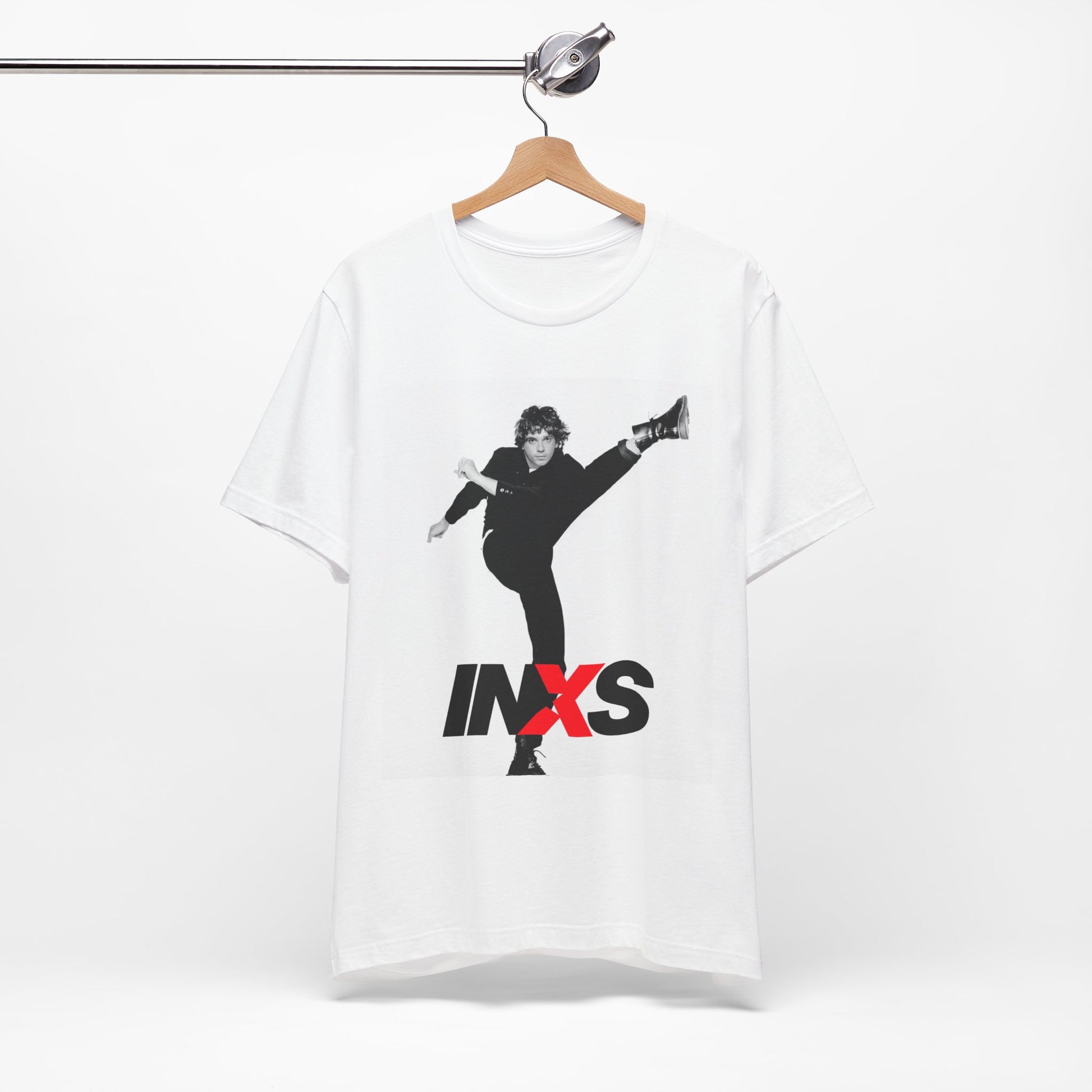 A black graphic t-shirt featuring a retro graphic related to INXS's 'Kick' album era.