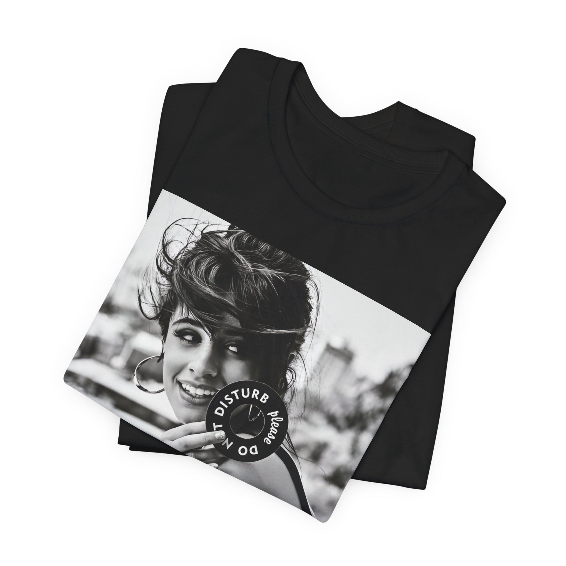 A black graphic t-shirt featuring a black and white photo or graphic of Camila Cabello in an iconic style.