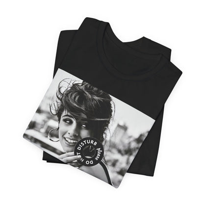 A black graphic t-shirt featuring a black and white photo or graphic of Camila Cabello in an iconic style.