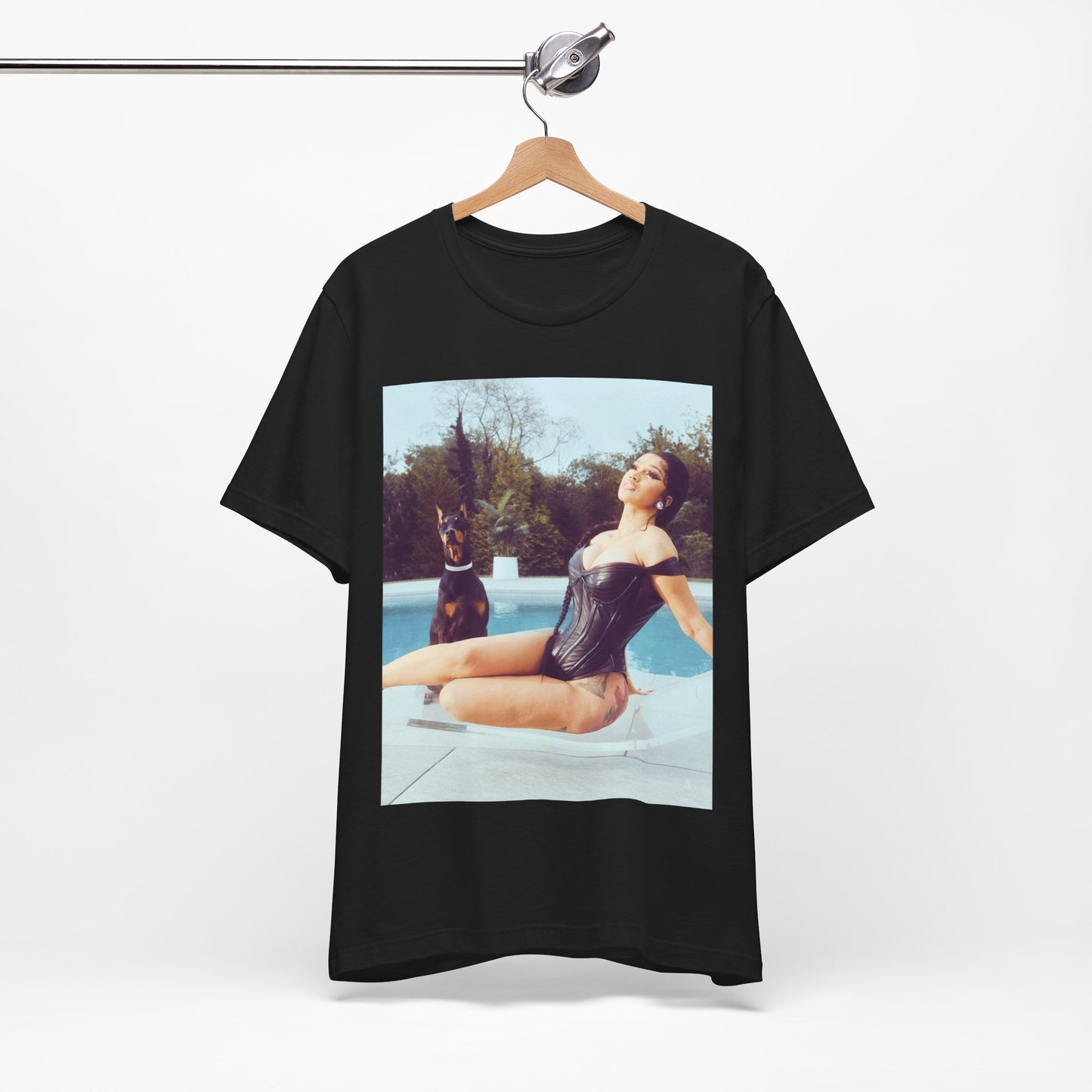 A black graphic t-shirt featuring a graphic related to Cardi B's 'I Like It' song, with bold pop culture elements.