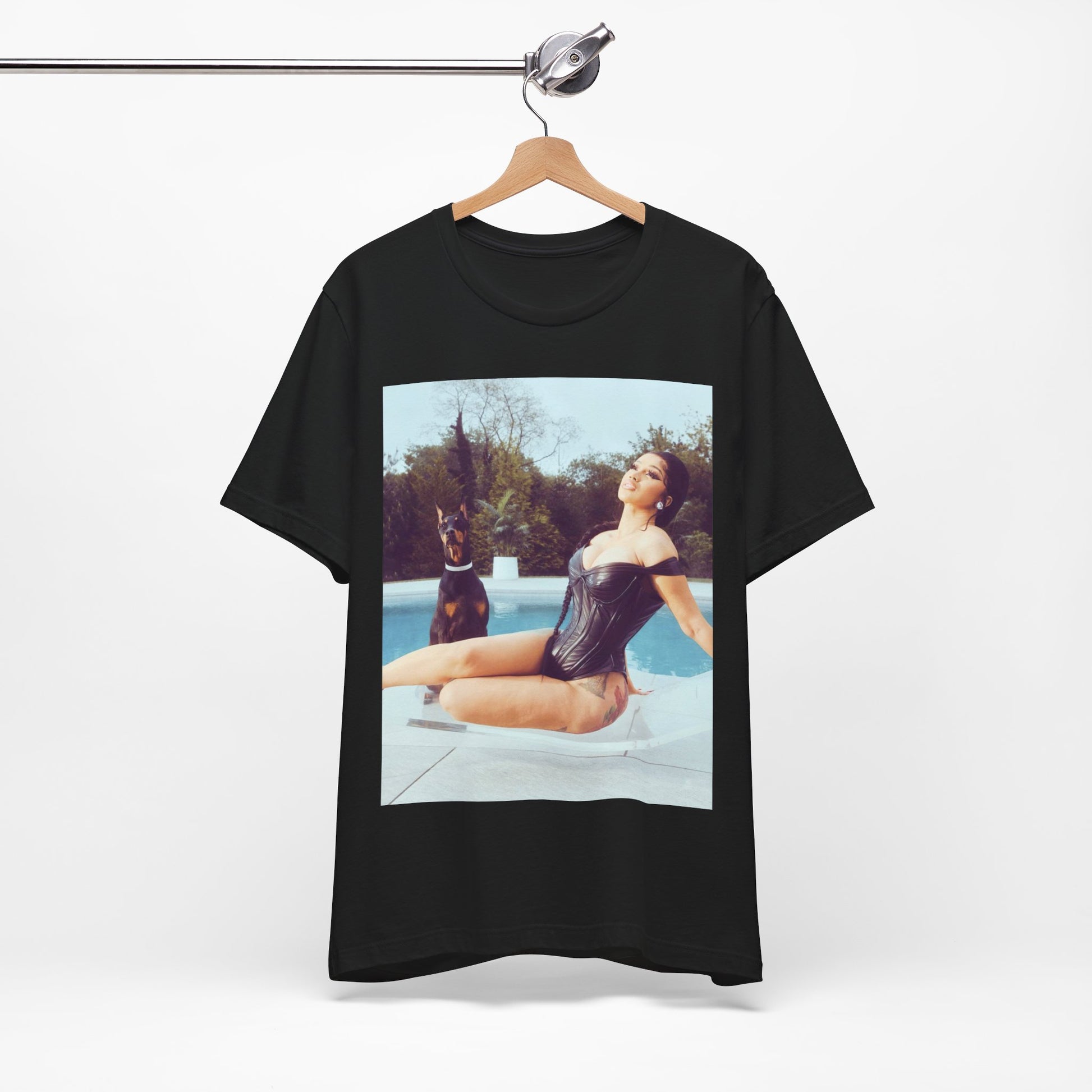 A black graphic t-shirt featuring a graphic related to Cardi B's 'I Like It' song, with bold pop culture elements.