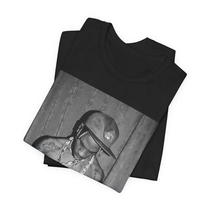 A black graphic t-shirt featuring a graphic of Travis Scott as the Houston rap king.