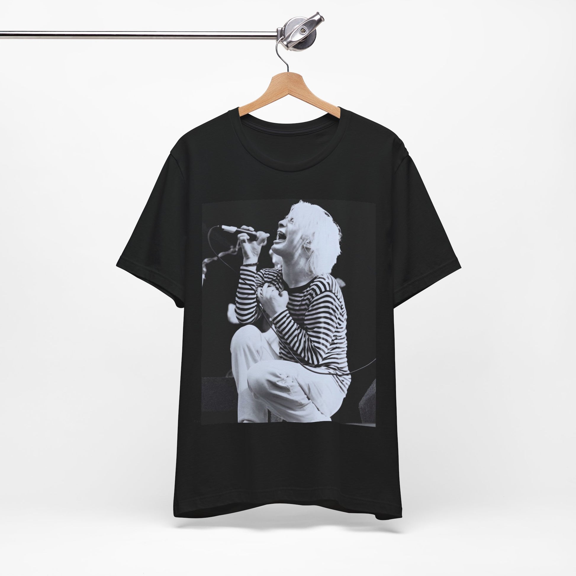 A black graphic t-shirt featuring a black and white graphic or photo of Radiohead performing live.
