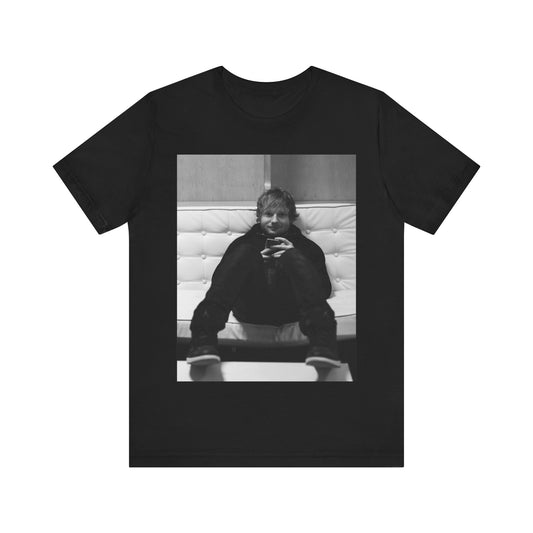 A black graphic t-shirt featuring a bold black and white graphic of Ed Sheeran.