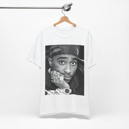 A black graphic t-shirt featuring a bold graphic of Tupac as a rap superstar.