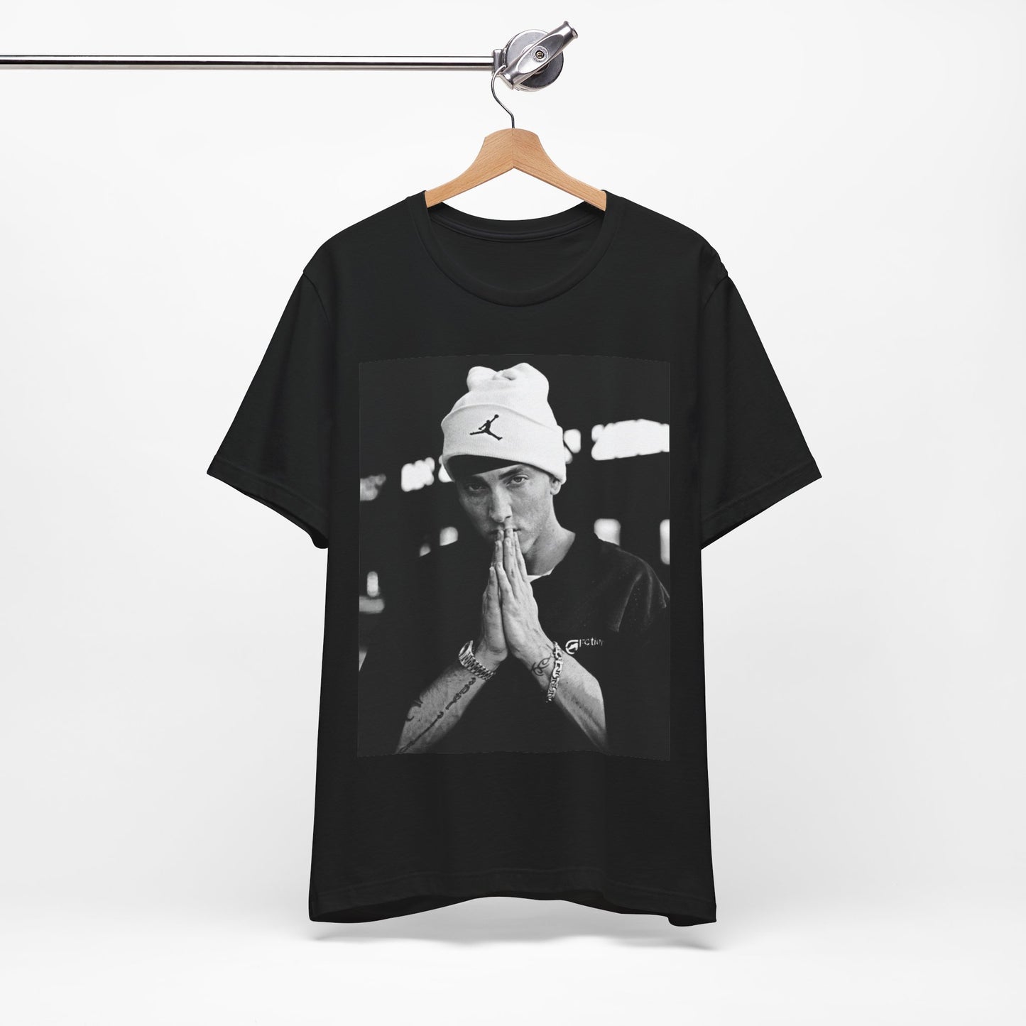 A black graphic t-shirt featuring a black and white portrait photo of Eminem.