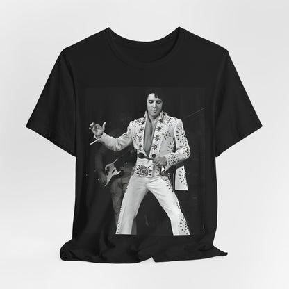 A black graphic t-shirt featuring a stylized graphic of Elvis Presley as The King of Rock 'n' Roll.