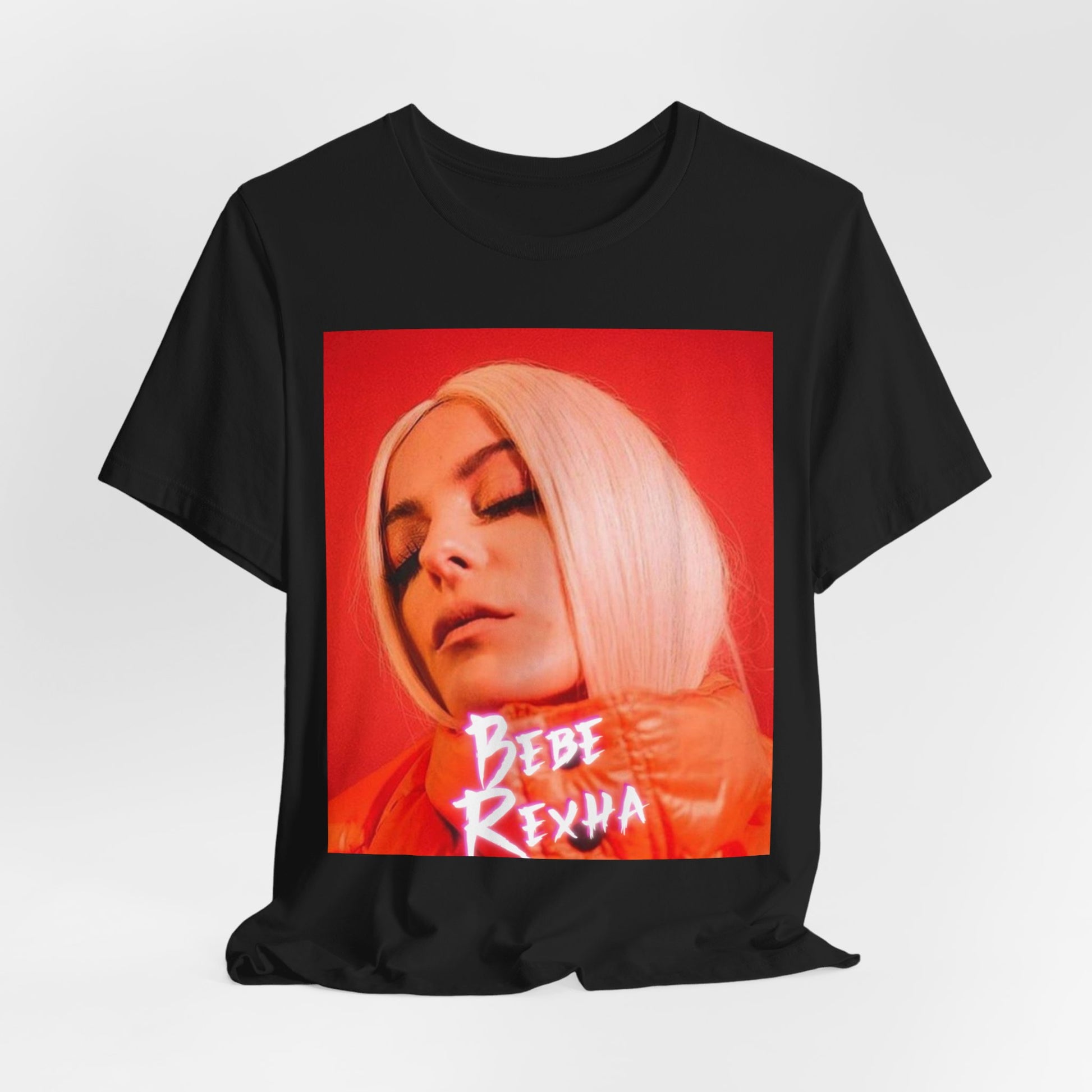 A black graphic t-shirt featuring a graphic of Bebe Rexha, designed with a glamorous or dazzling aesthetic.