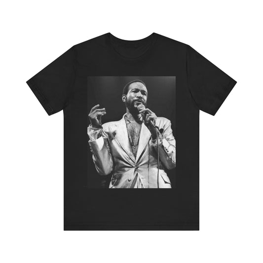 A black graphic t-shirt featuring a retro black and white photo or graphic of Marvin Gaye performing live on stage.
