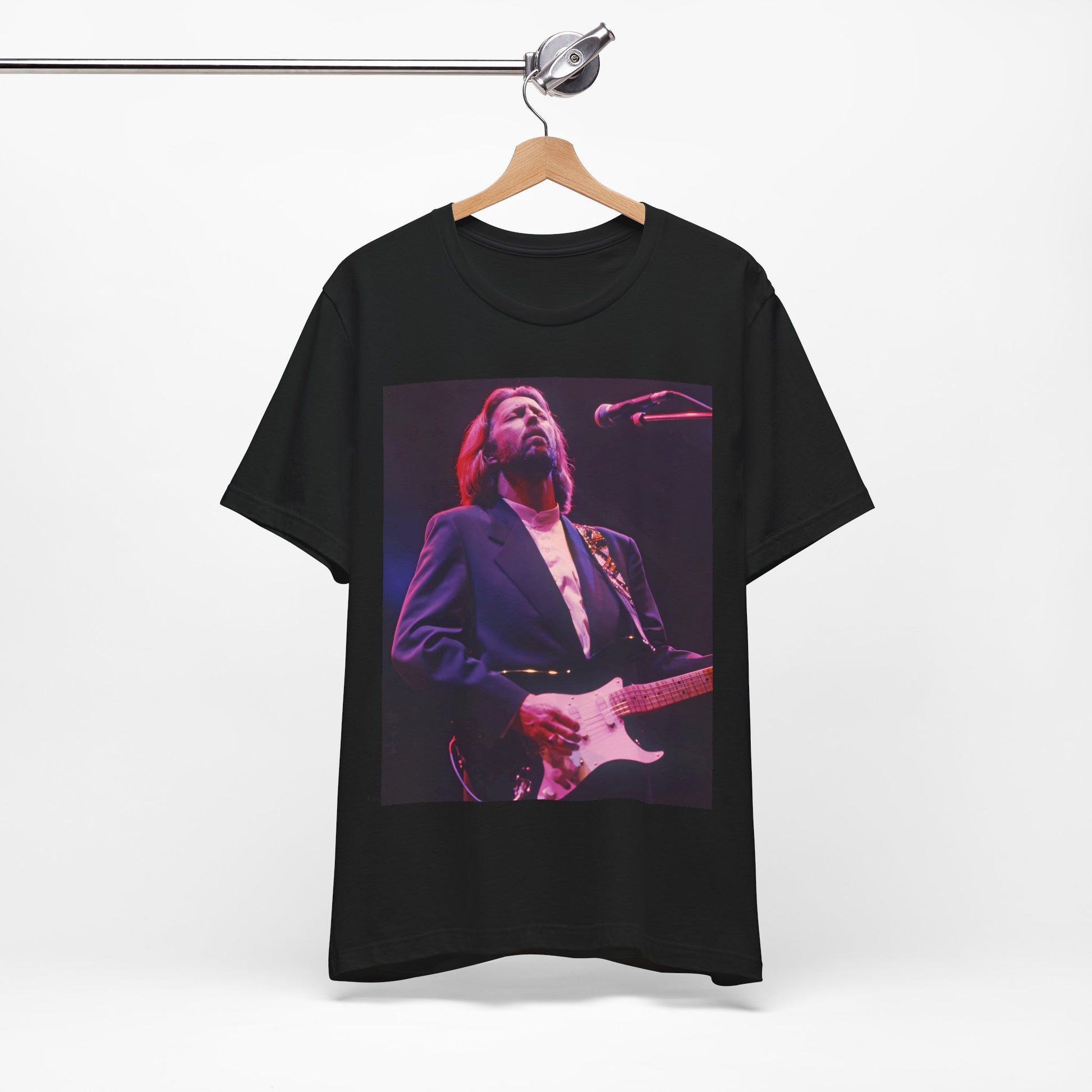 A black graphic t-shirt featuring a vintage graphic of Eric Clapton as a blues rock icon.