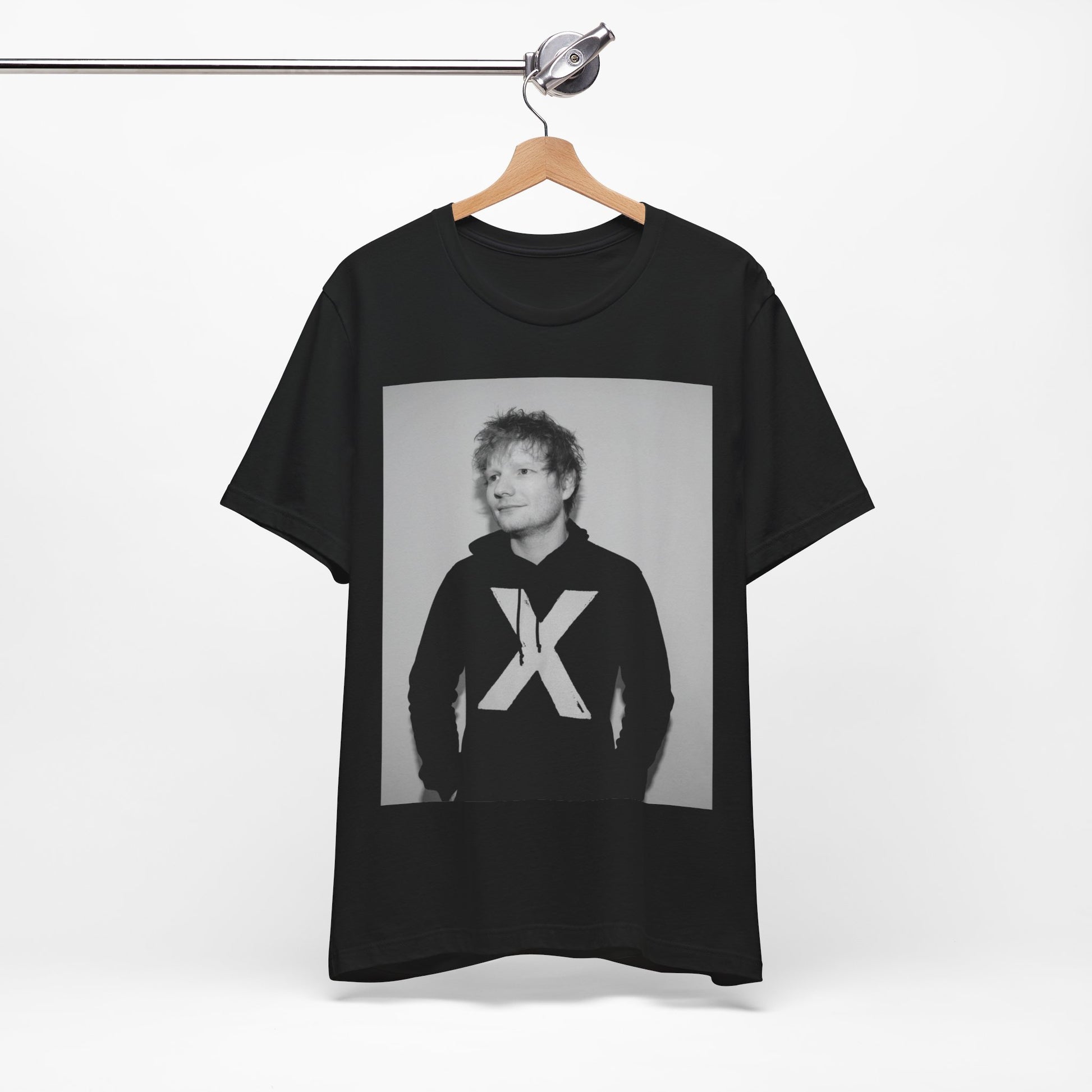 A black graphic t-shirt featuring a black and white graphic related to Ed Sheeran's album 'X'.