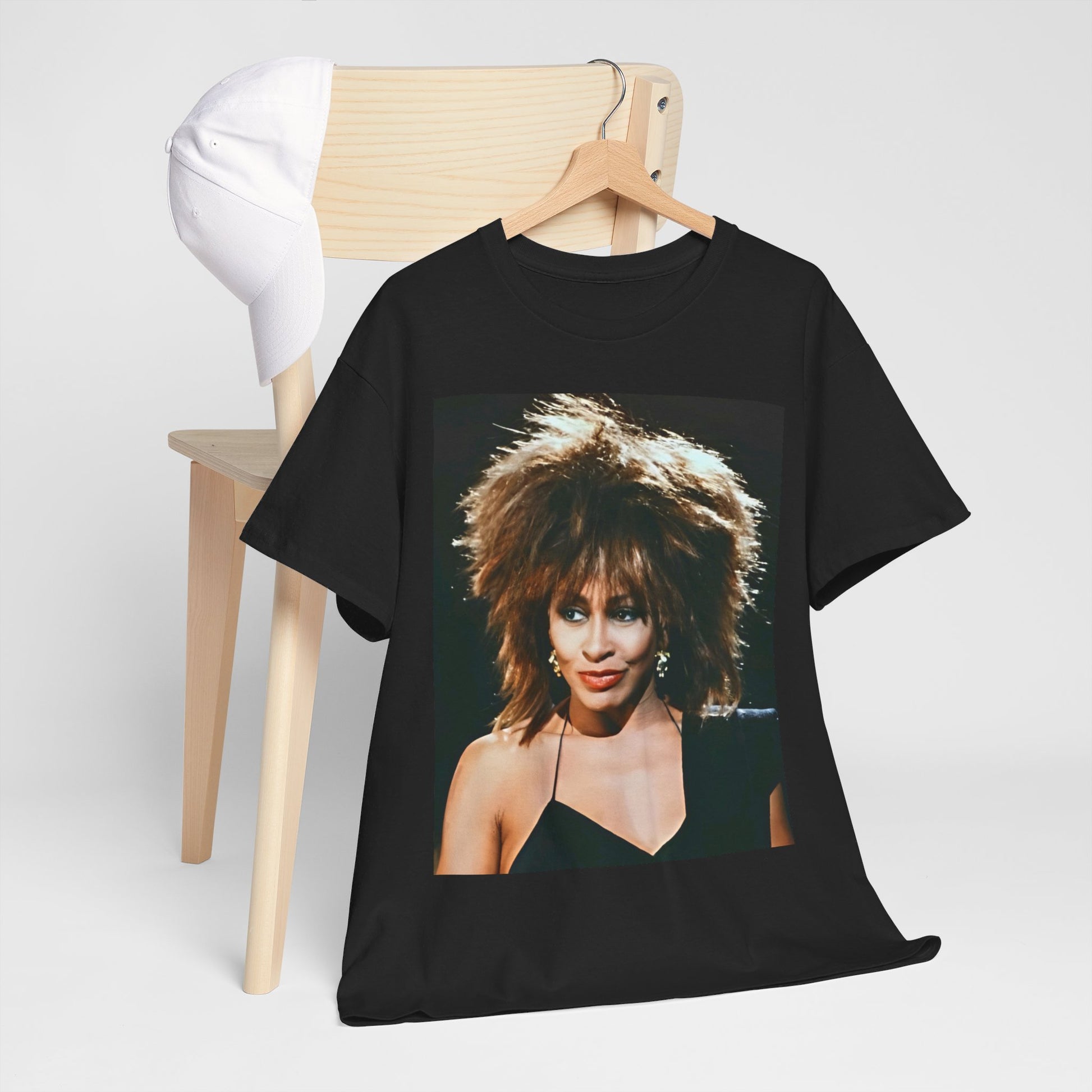A black graphic t-shirt featuring a graphic of Tina Turner as the Queen of Rock & Roll.