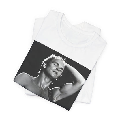 A black graphic t-shirt featuring a graphic or photo of Sting performing live on stage in 1983.