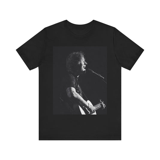 A black graphic t-shirt featuring a graphic related to Ed Sheeran's stadium tour.