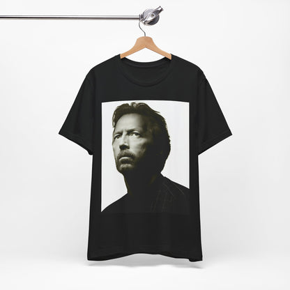 A black graphic t-shirt featuring a retro black and white portrait photo of Eric Clapton.