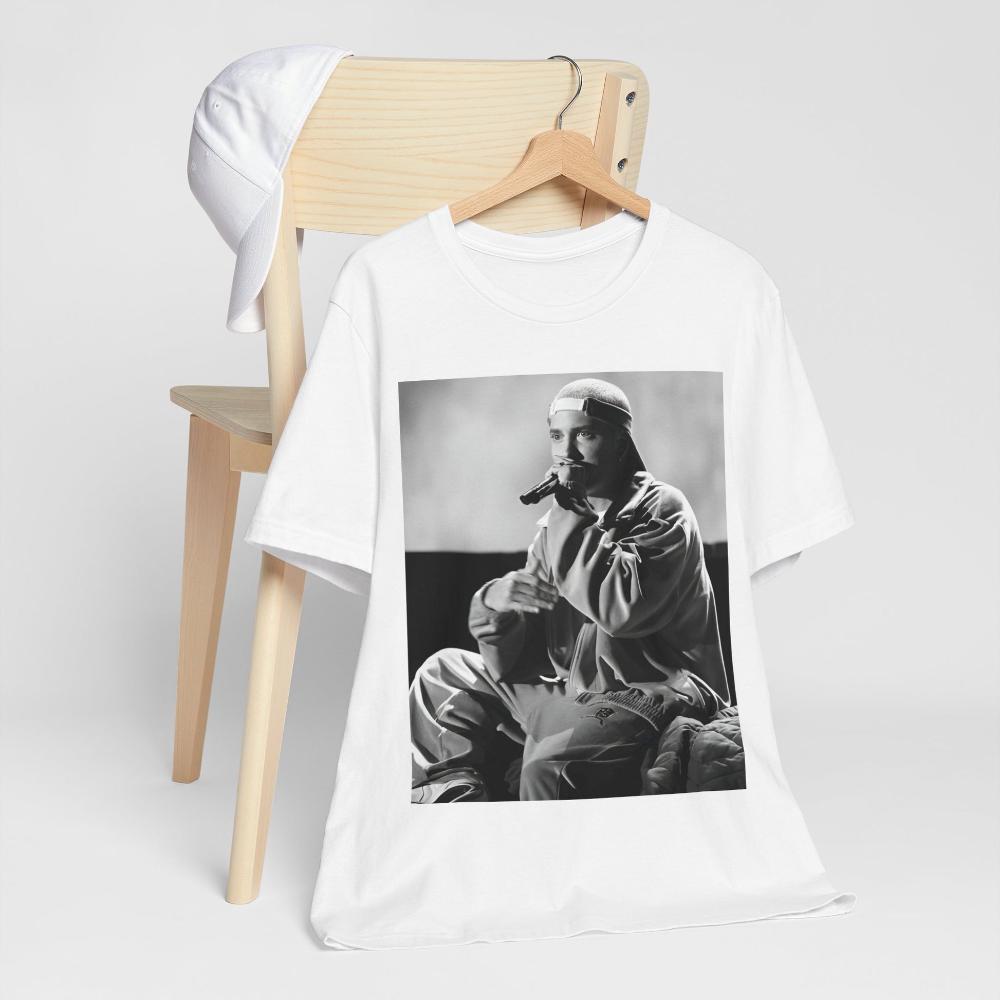 A black graphic t-shirt featuring a black and white graphic of Eminem as a 'Rap Messiah'.