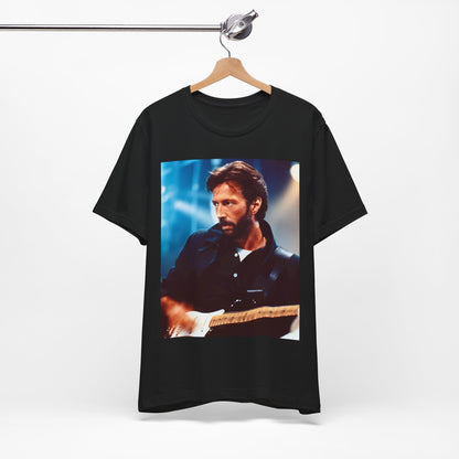 A black graphic t-shirt featuring a retro graphic or photo of Eric Clapton performing live on stage.