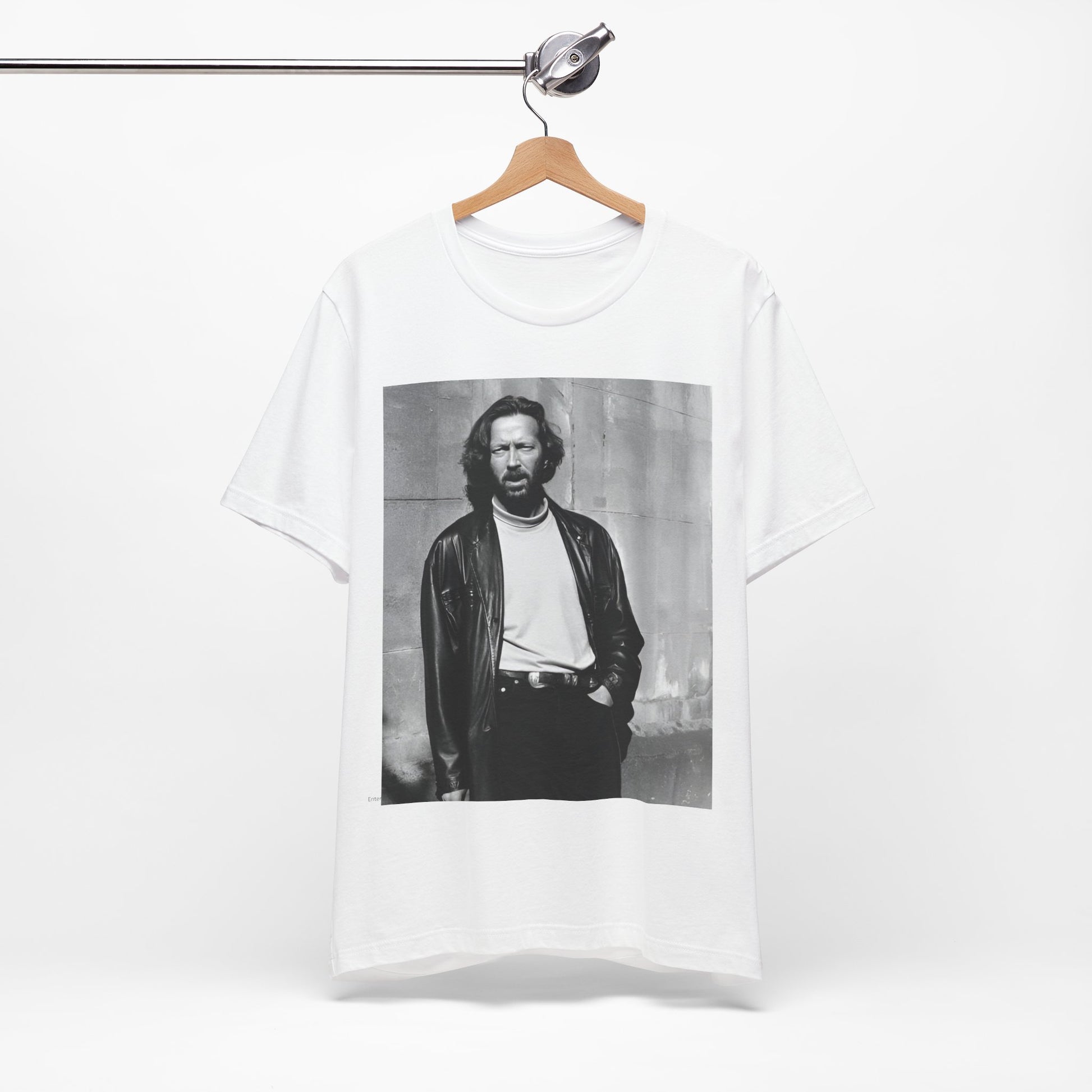 A black graphic t-shirt featuring a retro graphic related to Eric Clapton's 'Cocaine' song or era.