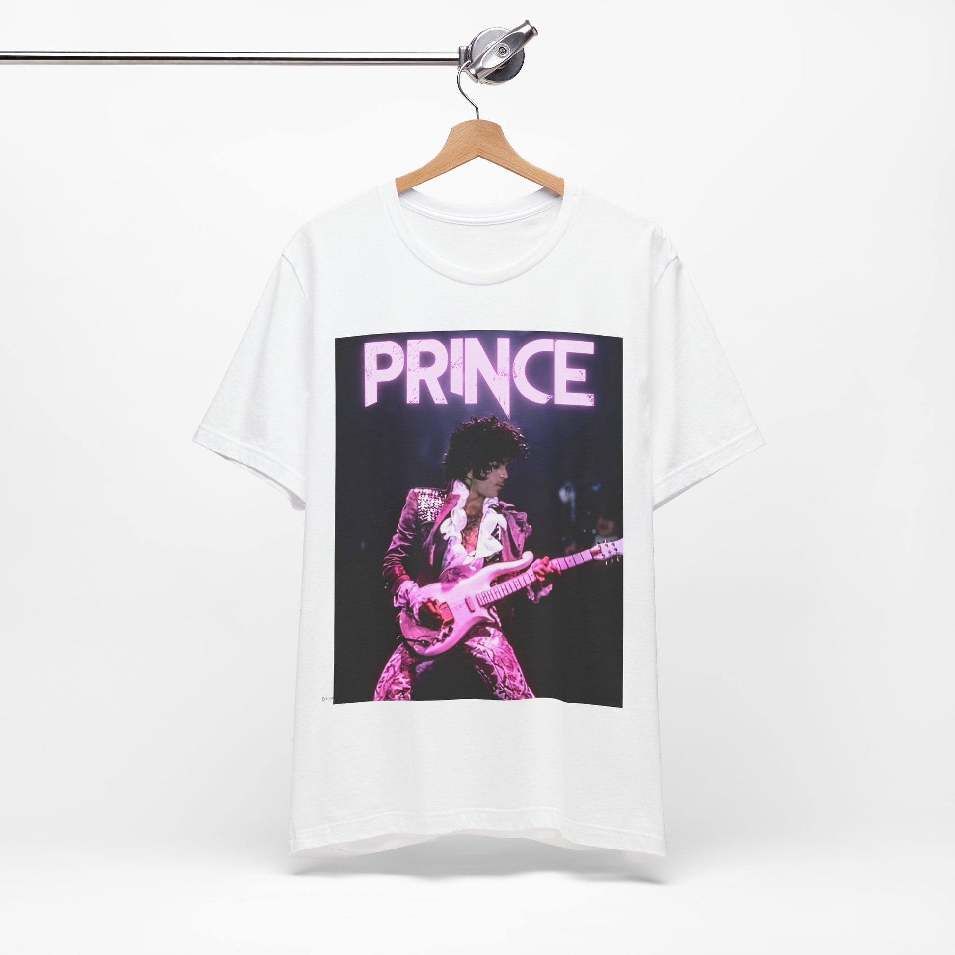 A black graphic t-shirt featuring an 80s pop genius graphic of Prince.