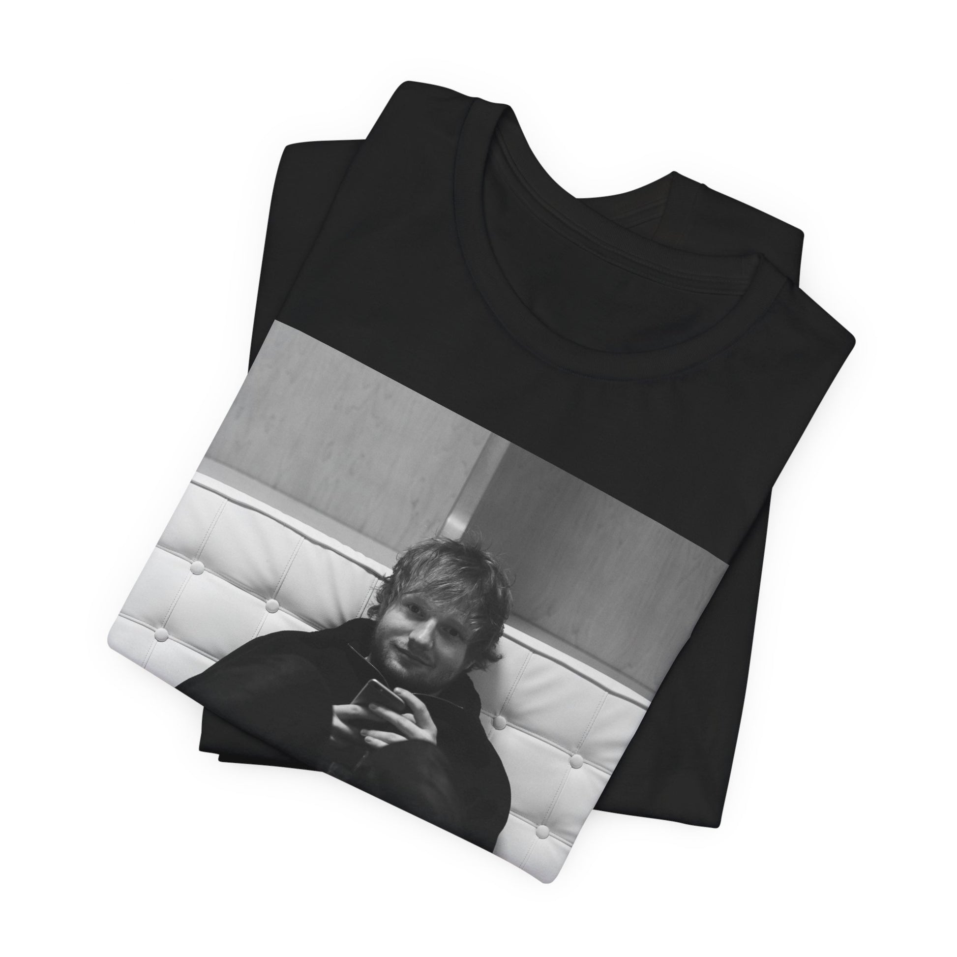 A black graphic t-shirt featuring a bold black and white graphic of Ed Sheeran.