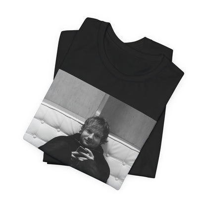 A black graphic t-shirt featuring a bold black and white graphic of Ed Sheeran.