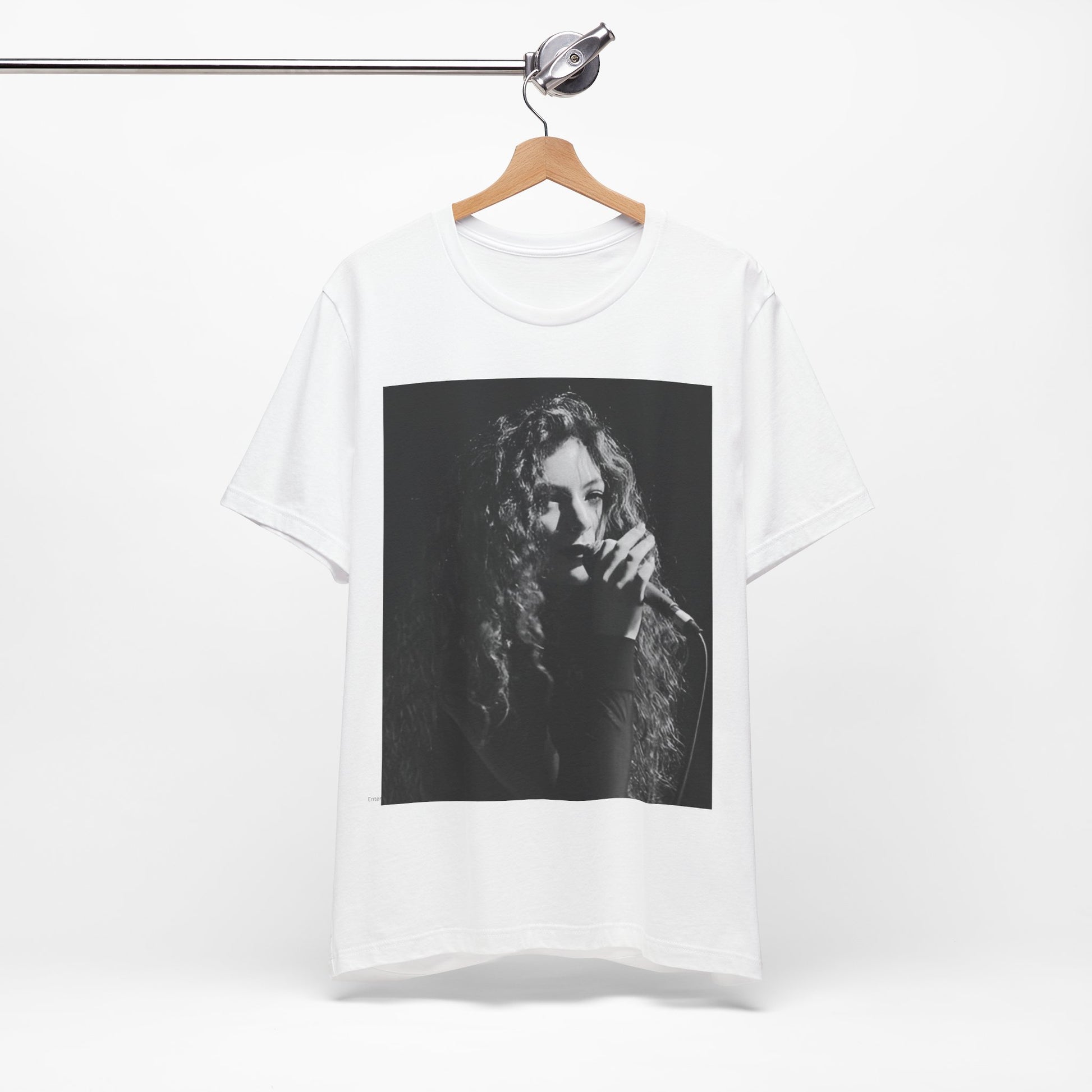 A black graphic t-shirt featuring a graphic or photo of Lorde performing live.