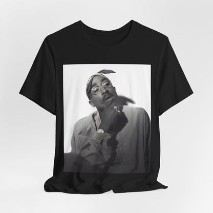 A black graphic t-shirt featuring a classic 90s West Coast rap graphic of Tupac.