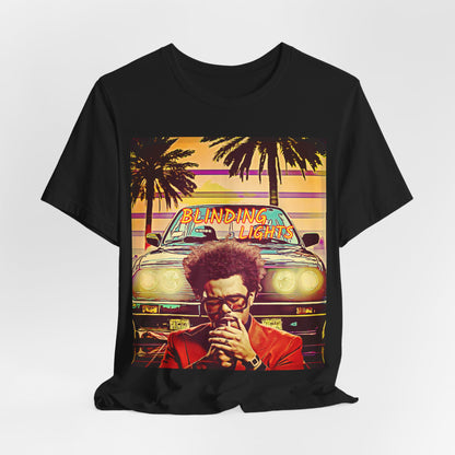 A black graphic t-shirt featuring a graphic related to The Weeknd's 'Blinding Lights' song.