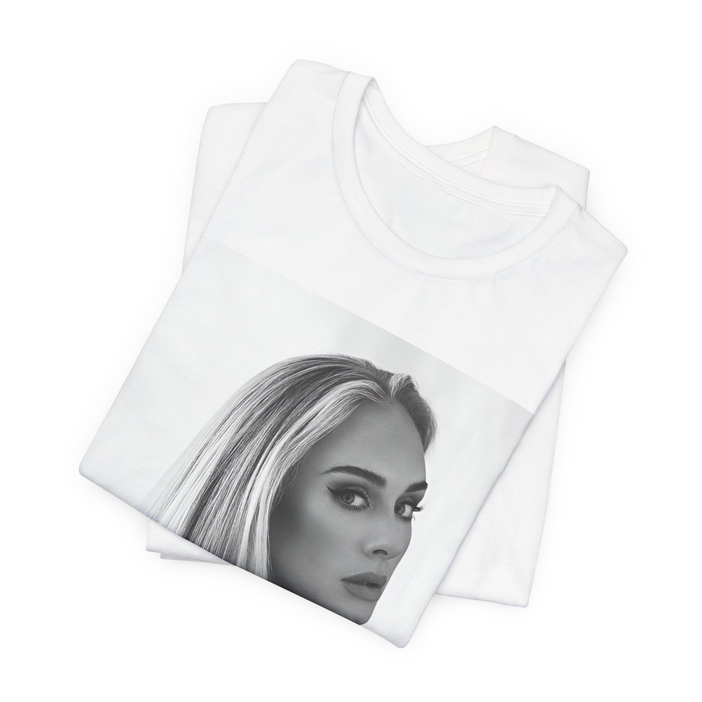 A black graphic t-shirt featuring a black and white, monochromatic portrait of Adele, showing her with a serene or thoughtful expression.
