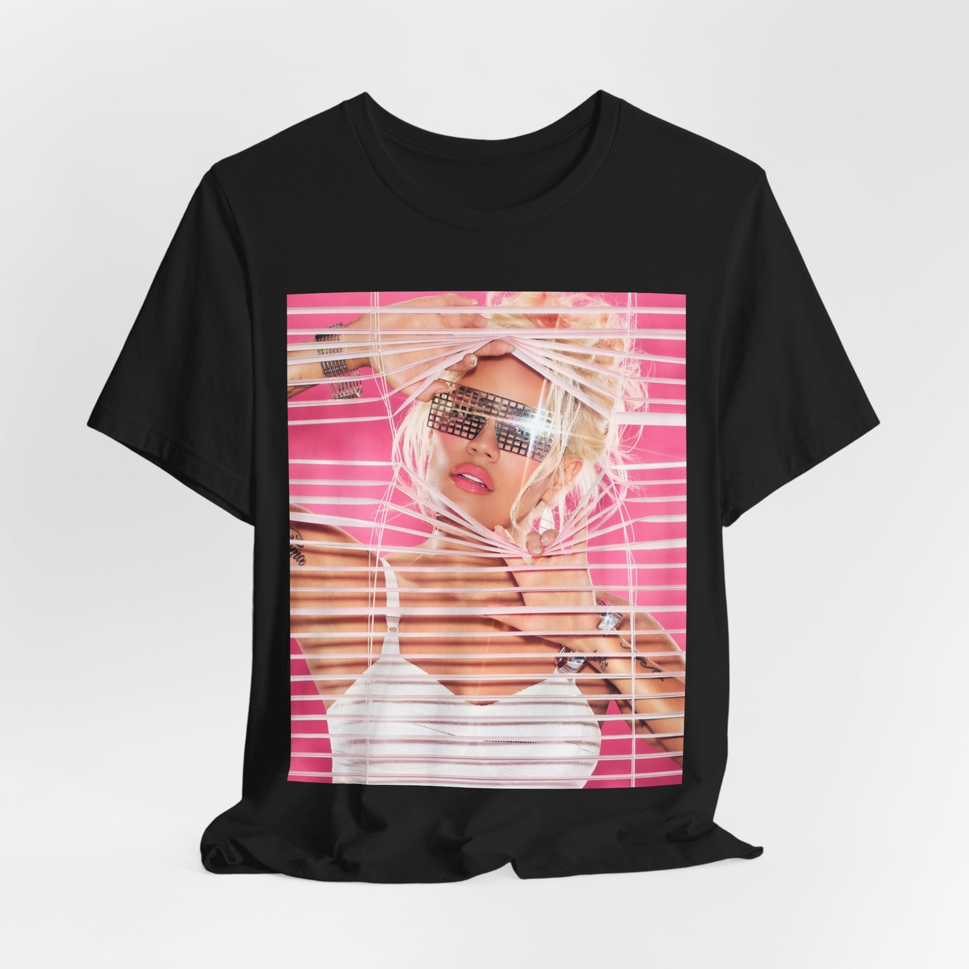 A black graphic t-shirt featuring a graphic of Karol G in a cool Latin trap style.