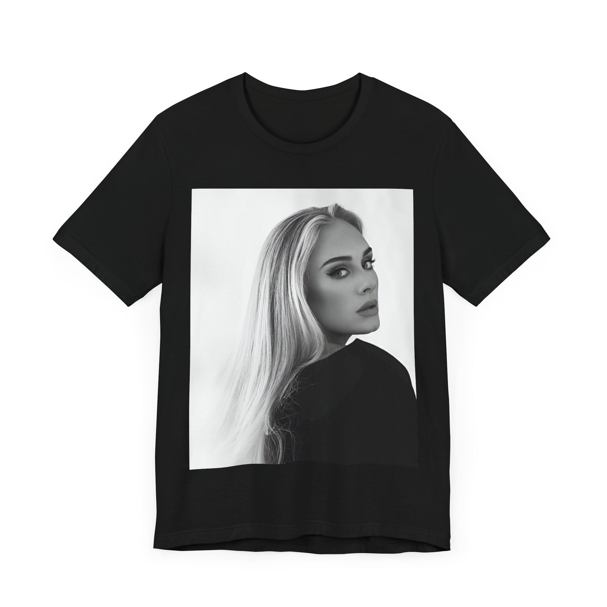 A black graphic t-shirt featuring a black and white, monochromatic portrait of Adele, showing her with a serene or thoughtful expression.