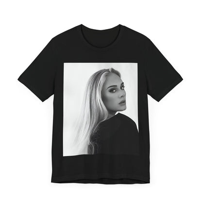 A black graphic t-shirt featuring a black and white, monochromatic portrait of Adele, showing her with a serene or thoughtful expression.