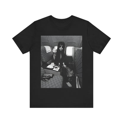 A black graphic t-shirt featuring a vintage 70s-style illustration of an airplane with Aerosmith branding, representing their tour plane from that era.