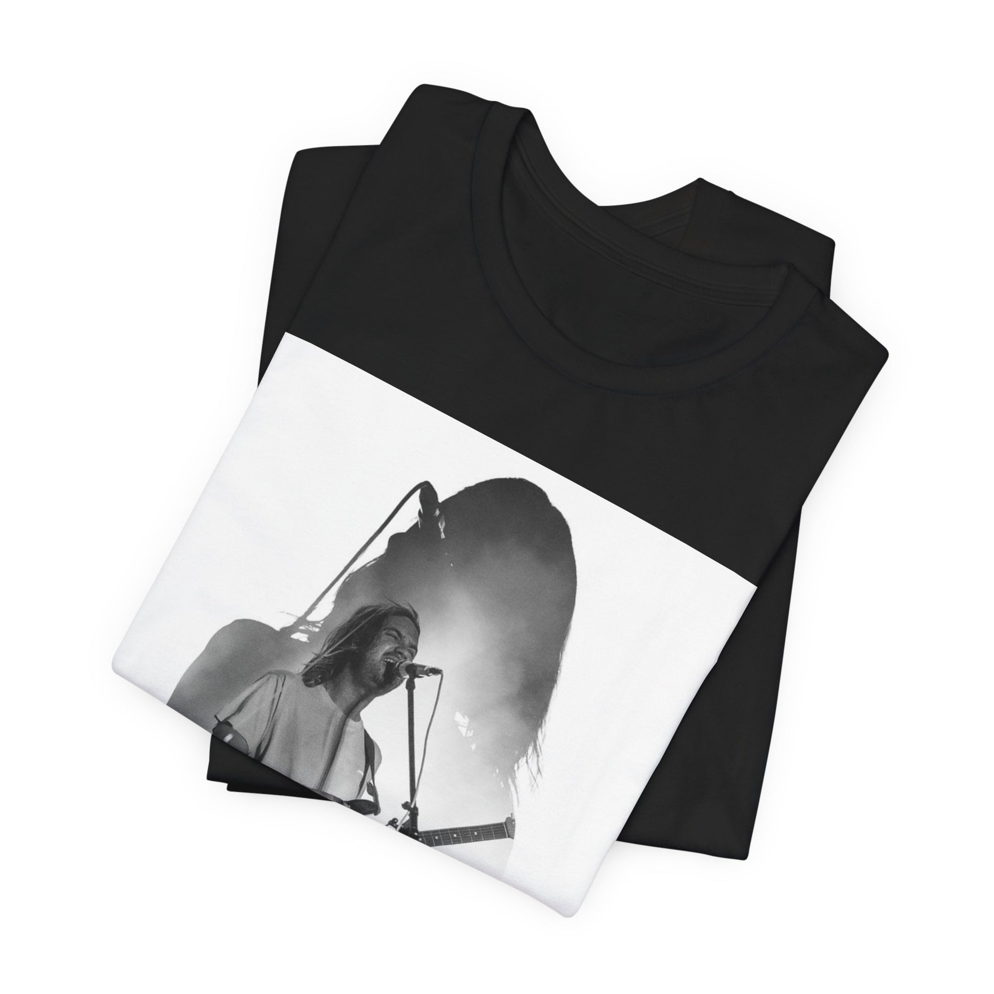 A black graphic t-shirt featuring a black and white, monochrome graphic or photo of Tame Impala.