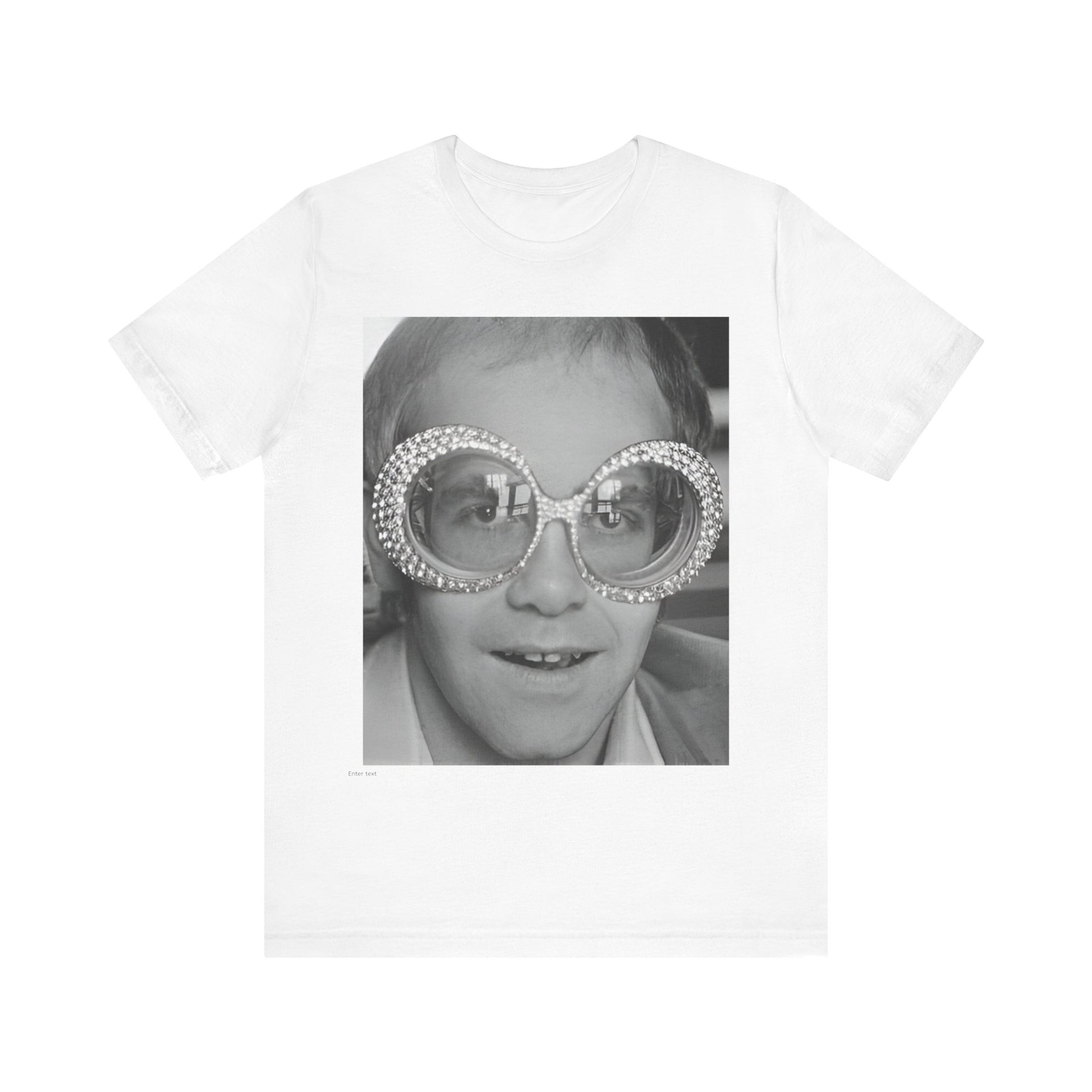 A black graphic t-shirt featuring a graphic of Elton John emphasizing his iconic glasses and fashion.