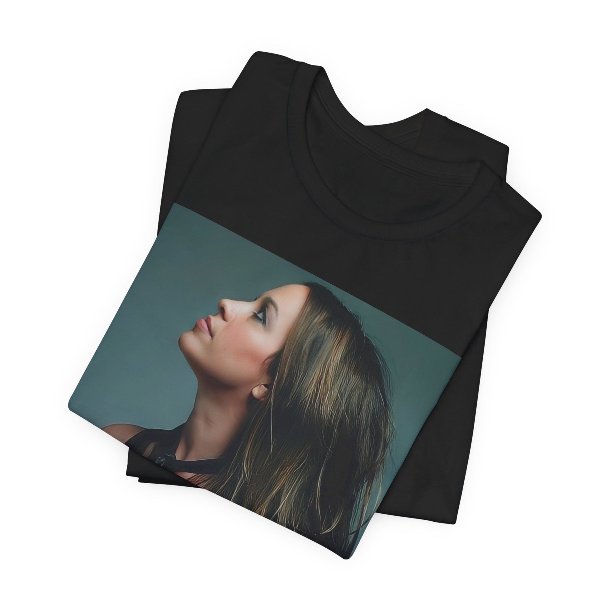 A black graphic t-shirt featuring a retro-style graphic of Alanis Morissette, possibly with her signature or a unique artistic interpretation.