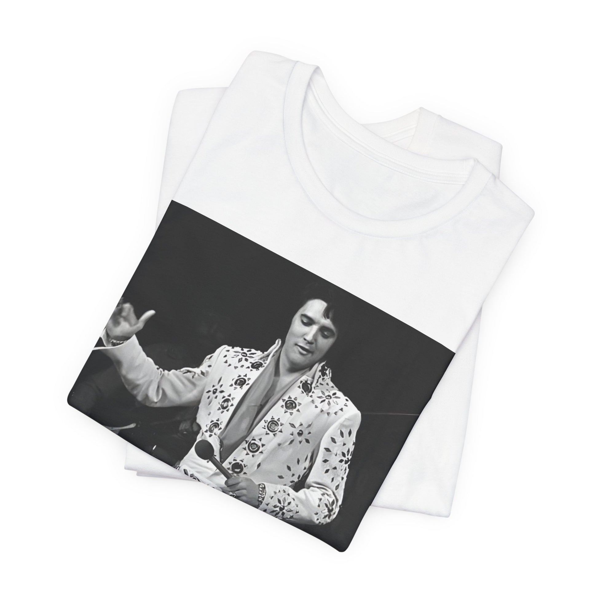 A black graphic t-shirt featuring a stylized graphic of Elvis Presley as The King of Rock 'n' Roll.