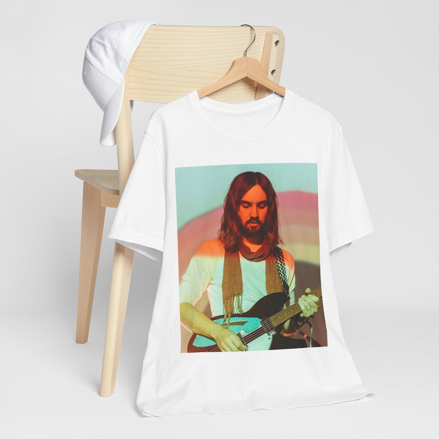 A black graphic t-shirt featuring a dream rock aesthetic graphic of Tame Impala.