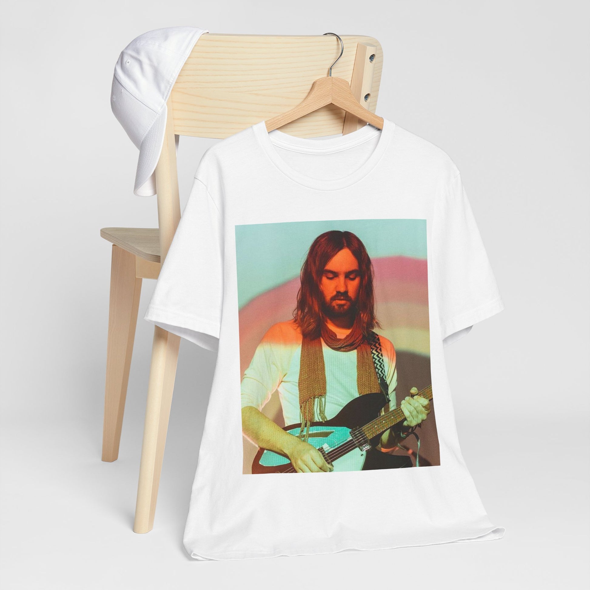 A black graphic t-shirt featuring a dream rock aesthetic graphic of Tame Impala.