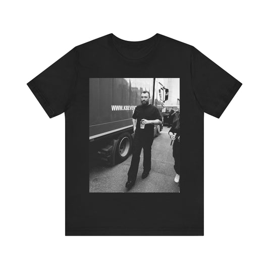 A black graphic t-shirt featuring a graphic or photo of Sam Smith in a backstage setting.