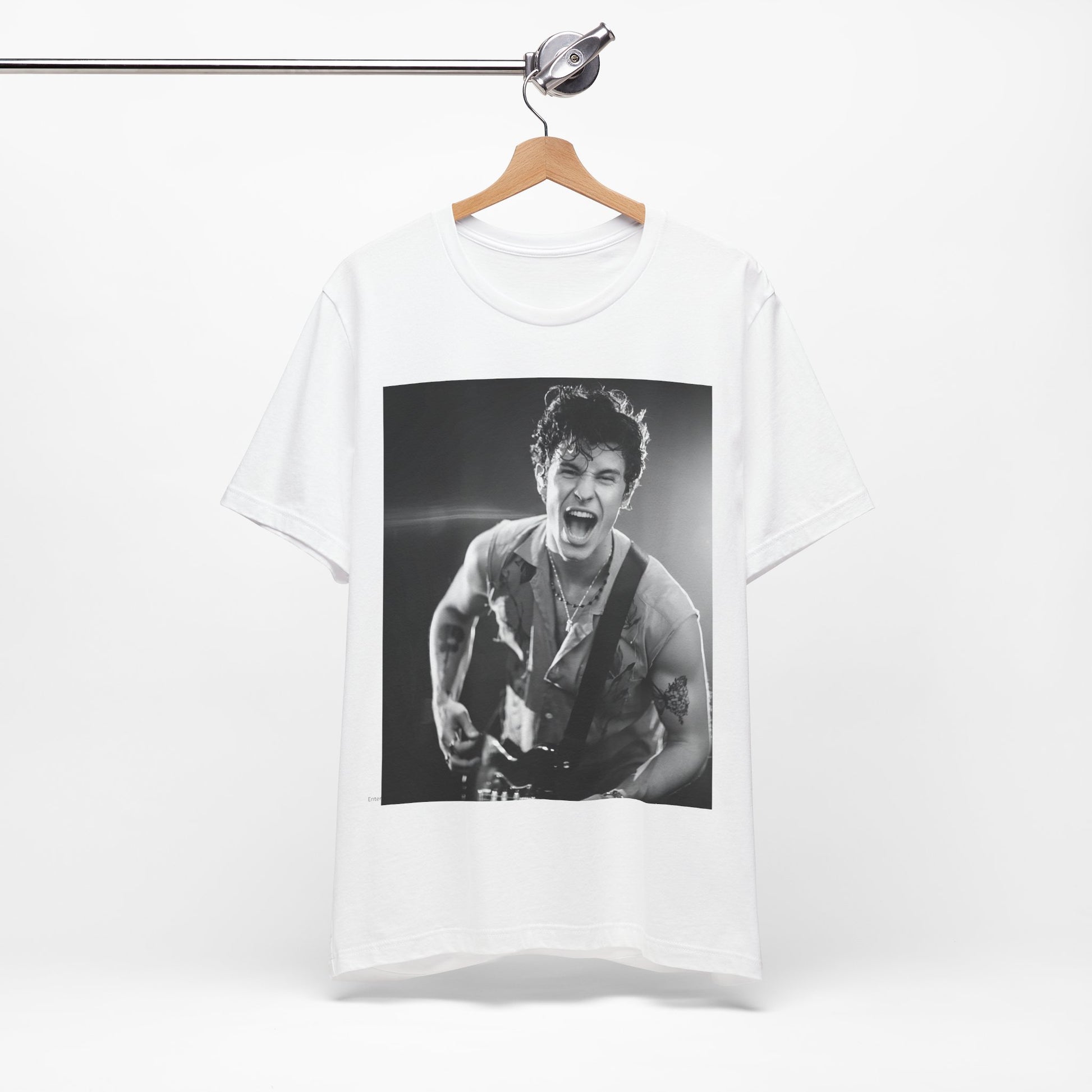 A black graphic t-shirt featuring a black and white photo of Shawn Mendes, emphasizing his charm.