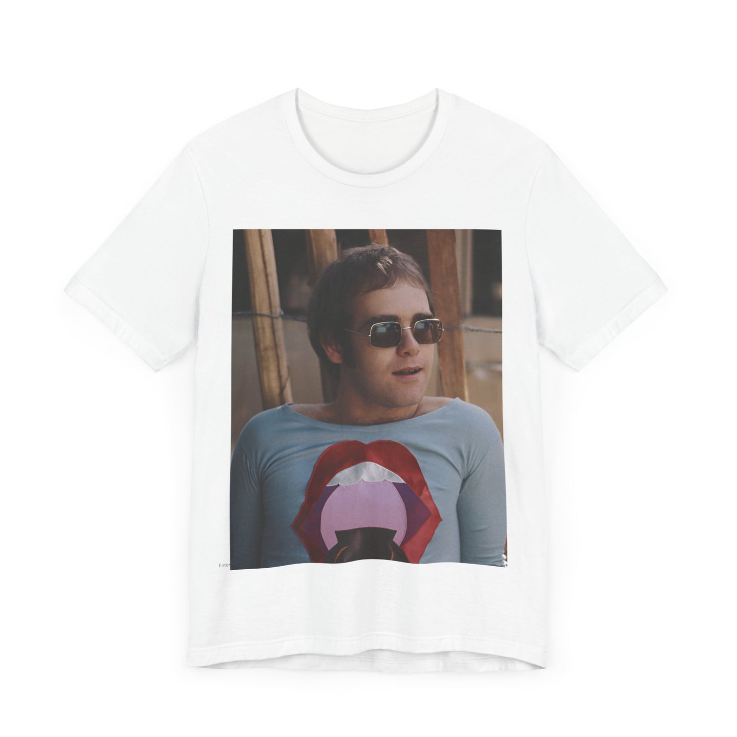 A black graphic t-shirt featuring a classic graphic related to Elton John's 'Tiny Dancer' song or era.