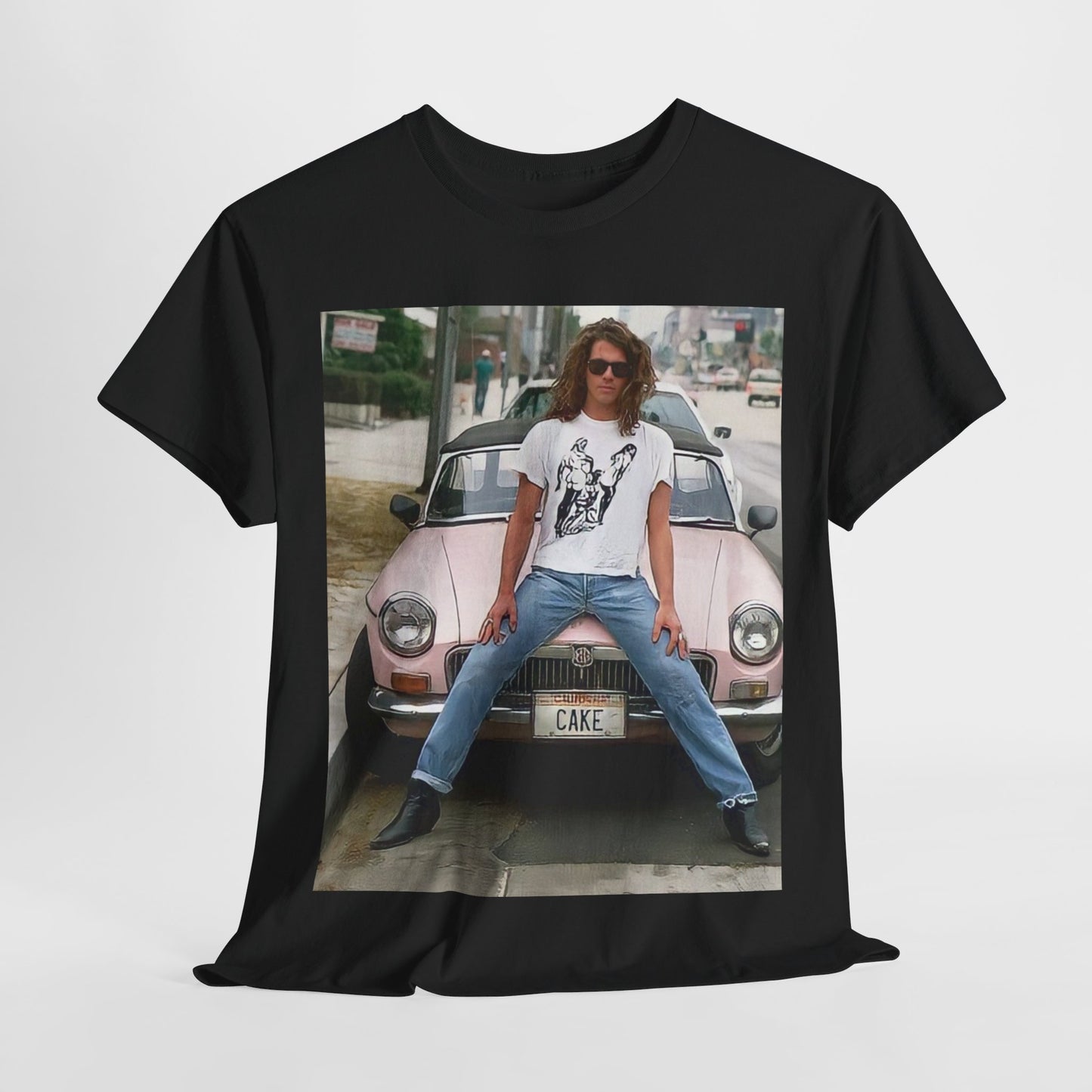 A black graphic t-shirt featuring a vintage photo of INXS band members with a classic car.