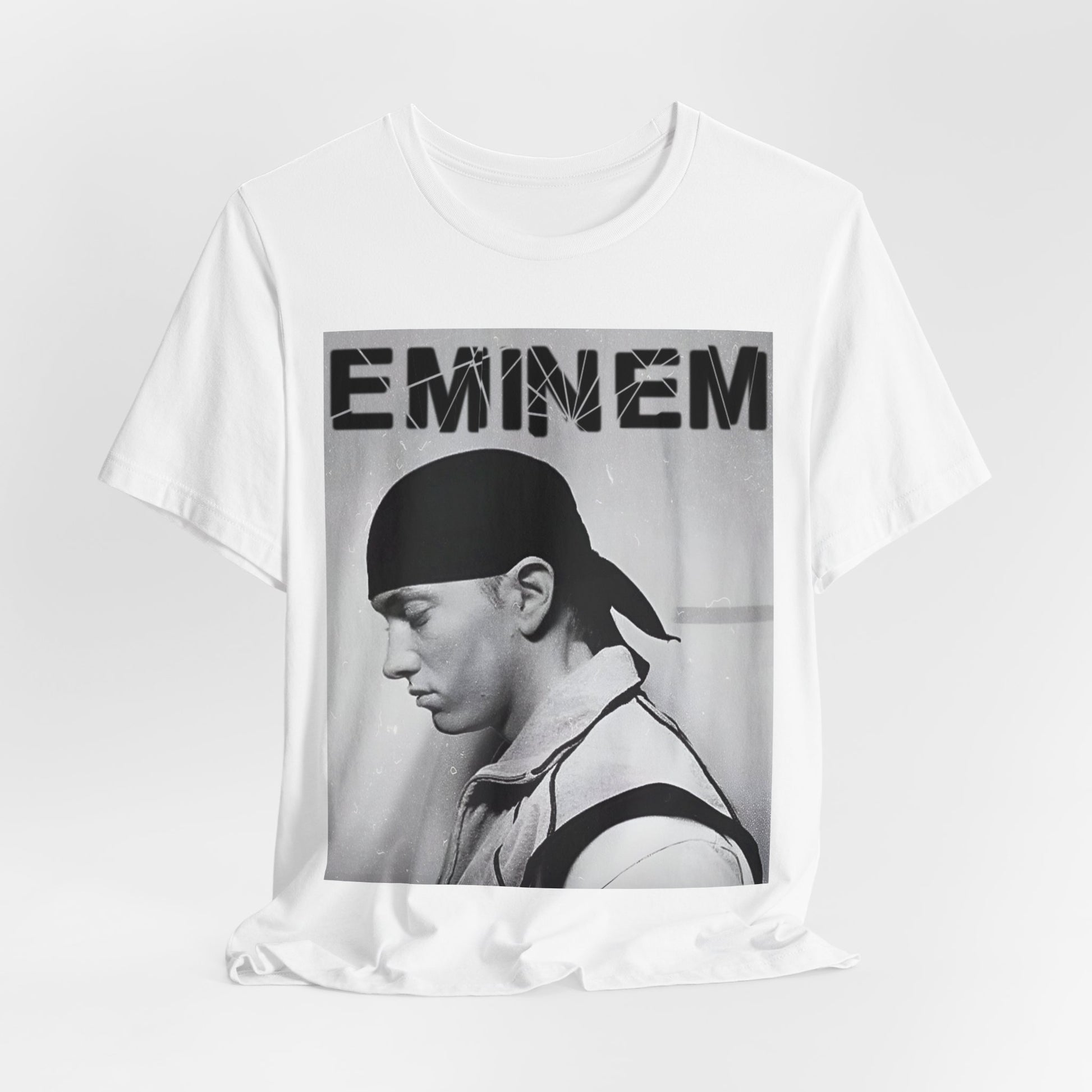 A black graphic t-shirt featuring a stylized graphic of Eminem as a modern rap legend.